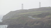 SX00272 Two of the White Towers and Metal Man Tramore.jpg